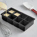 A black Choice silicone ice mold tray with 8 cubes.