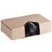 A Lavex cardboard box with black garbage bags inside.