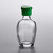 A clear glass Town Round soy sauce bottle with a green cap.