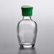 A clear glass Town soy sauce bottle with a green lid.