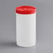 A white container with a red lid.