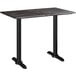 A Lancaster Table & Seating rectangular counter height table with black legs and a black top.