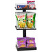 A Cal-Mil black metal 3-tier shelf with snacks on it.