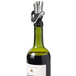 A green wine bottle with a metal OXO wine pourer / stopper in the cork.
