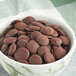 A bowl of Cacao Barry dark chocolate pistoles.