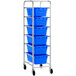 A Regency mobile aluminum lug rack with blue plastic meat lugs on it.