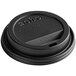 A black Dart Traveler ThermoGuard hot cup lid with a sip hole on a table.