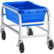 A silver Regency aluminum lug rack with a blue meat lug on a blue cart with black wheels.