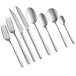 A close-up of several Acopa Petra stainless steel dinner forks.
