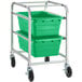 A metal rack with two green plastic bins on it.