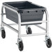 A black plastic bin with silver metal legs on a wheeled cart.