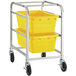 A metal cart with two yellow plastic bins on it.