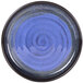 A close-up of a blue Elite Global Solutions Monet melamine plate with a black swirl design on the rim.