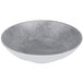 An Elite Global Solutions Denali cement melamine bowl with a grey surface and white rim.