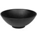 A matte black melamine bowl with an embossed spiral design.