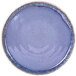 An indigo melamine plate with a speckled pattern on the rim.