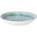 A white melamine bowl with a green and blue speckled surface.