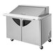 A Turbo Air stainless steel refrigerated sandwich prep table with 2 doors and 18 drawers.