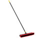 A red and black Quickie Bulldozer 2-in-1 Squeegee / Push Broom with a handle.
