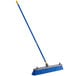 A Quickie Bulldozer blue and yellow push broom with a yellow handle.