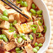 A bowl of Mabo Tofu with chopsticks on a white plate.