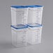 Three Vigor clear plastic food storage containers with blue lids.