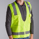 A man wearing a lime yellow Ergodyne safety vest.