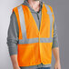A man wearing an Ergodyne orange reflective safety vest.