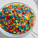 A bowl filled with colorful number sprinkles.