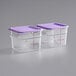 Two Vigor clear square plastic food storage containers with purple lids.