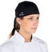 A woman wearing a black Headsweats chef bandana.