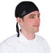 A man wearing a black Headsweats chef bandana.