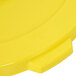 A close up of a yellow Continental Huskee trash can lid.