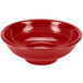 A red Fiesta pedestal serving bowl on a white background.