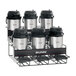 A Bunn universal airpot rack with six coffee pots on a counter.