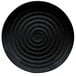 A black plate with a spiral pattern on it.