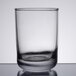 An Anchor Hocking clear glass tumbler on a white table.