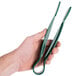 A hand holding a pair of green Thunder Group polycarbonate flat grip tongs.