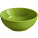 An Acopa Capri green stoneware bowl with a rim on a white background.