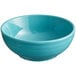 A Caribbean turquoise Acopa Capri stoneware bowl on a white surface.