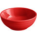 An Acopa Capri passion fruit red stoneware nappie bowl with a white background.