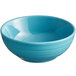 A close-up of a blue Acopa Capri stoneware bowl with a rim.