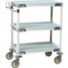 A MetroMax metal utility cart with three shelves and wheels.