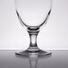 A Stolzle Nadine wine goblet on a reflective surface.