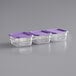 Three Vigor plastic food storage containers with purple lids on a counter.