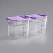 Two Vigor clear square polycarbonate plastic containers with purple lids.