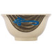 A white melamine bowl with a blue bird design and brown writing.