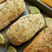 A tray of chicken breasts baked with Regal Herbs and Garlic Blend with lemon slices and herbs.