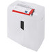 A white HSM ShredStar XS17 paper shredder with red and white paper on top.