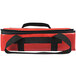 A red lunch bag with black straps.